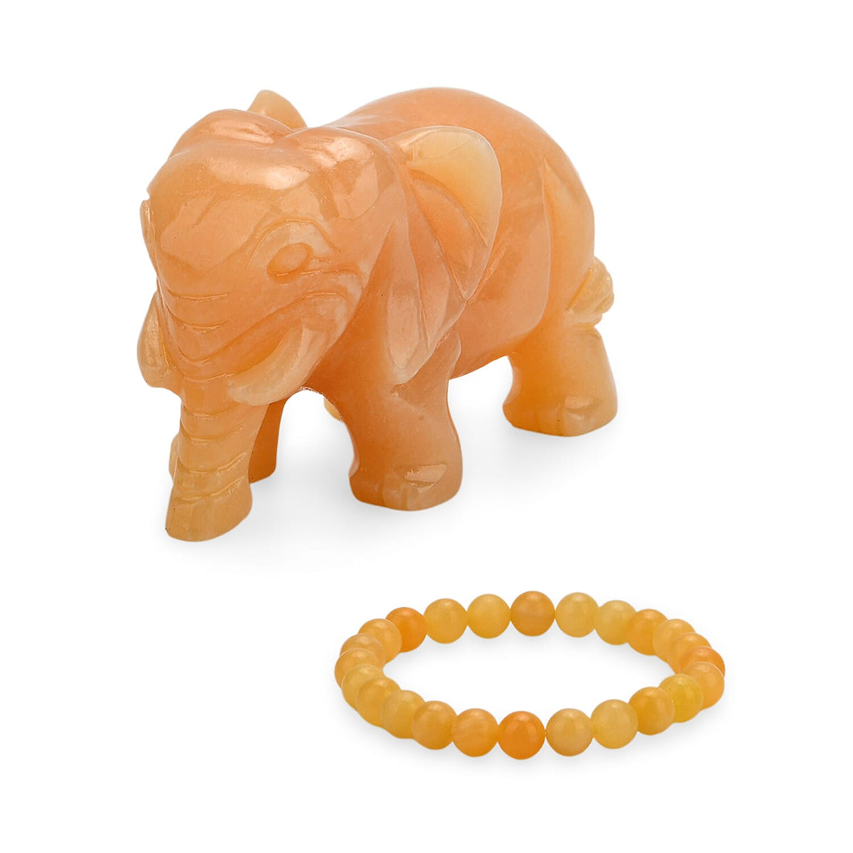 The Carved Treasure Collection - Honey Serpentine Carved Elephant Ornament 3205.00 Ct. V32536294 0
