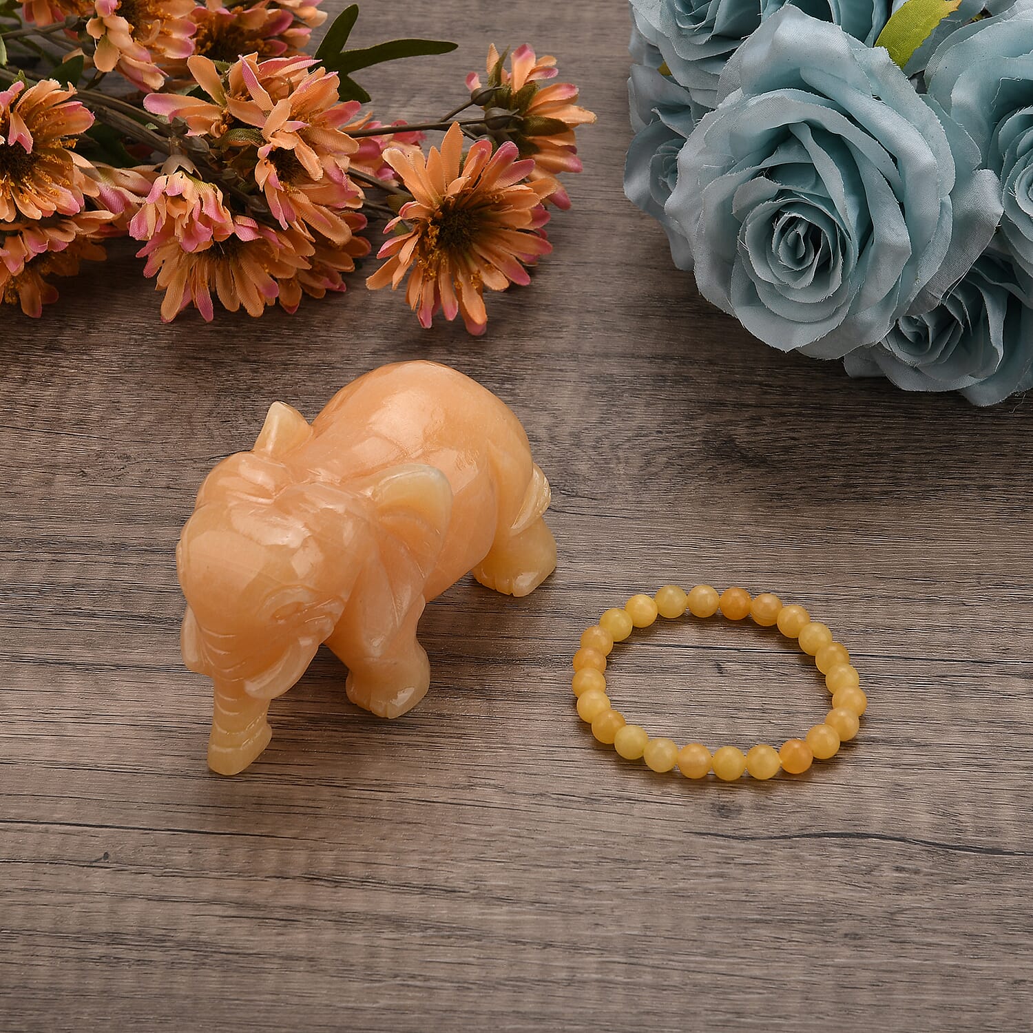 The Carved Treasure Collection - Honey Serpentine Carved Elephant Ornament 3205.00 Ct. V32536294 2