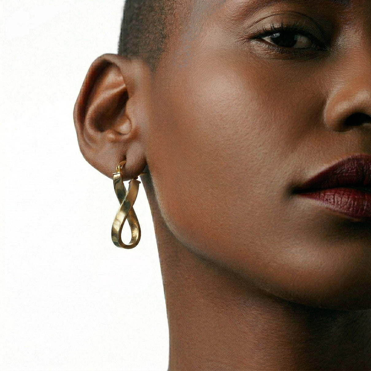9K Yellow Gold 10.5mm x 26.5mm Twist Oval Hoop Creole Earrings 7488819 1