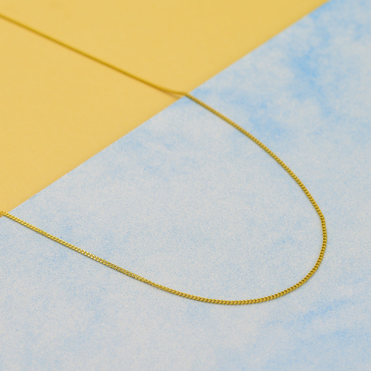 Hatton Garden Closeout - 9K Yellow Gold 0.6MM Diamond Cut Curb Necklace with Spring Ring Clasp 18 Inch 7711947 1