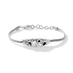 Sterling silver butterfly bracelet with blue sapphire accents on a woven chain with a lobster clasp