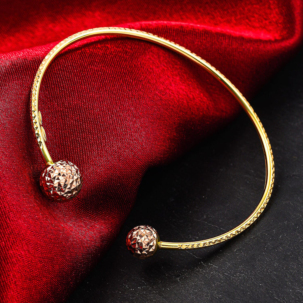 9K Two Colour Gold Diamond Cut Ball Torque Bangle