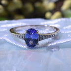 9K White Gold  Tanzanite ,  Moissanite  Ring 0.96 ct,  Gold Wt. 1.7 Gms  0.780  Ct.