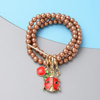 Set of 3 - Brown Shell Pearl Stretchable Enamelled Four Charm Bracelet in Gold Tone