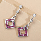 Cabo Delgado Ruby and Moissanite Dangle Earrings in Platinum Overlay Sterling Silver 2.86 Ct.