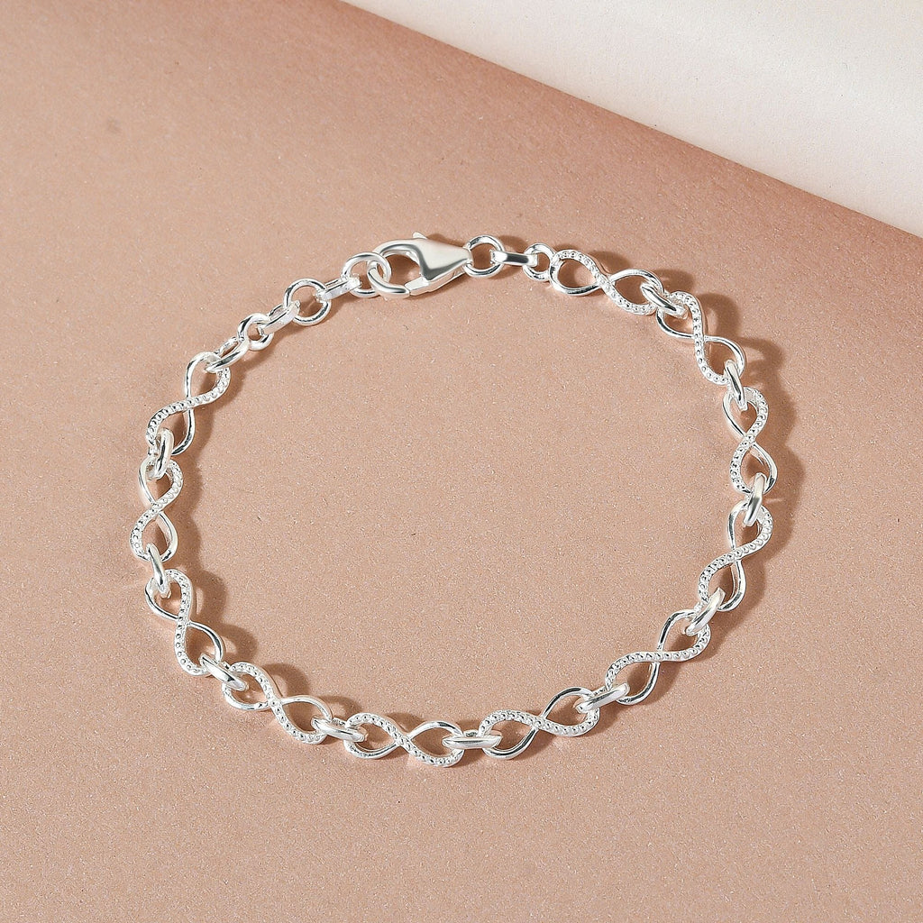 Designer Inspired - Platinum Overlay Sterling Silver Infinity Knot Bracelet (Size - 7) with Lobster Clasp, Silver Wt 6.60 Gms.