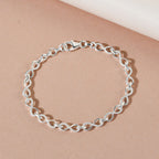 Designer Inspired - Platinum Overlay Sterling Silver Infinity Knot Bracelet (Size - 7) with Lobster Clasp, Silver Wt 6.60 Gms.