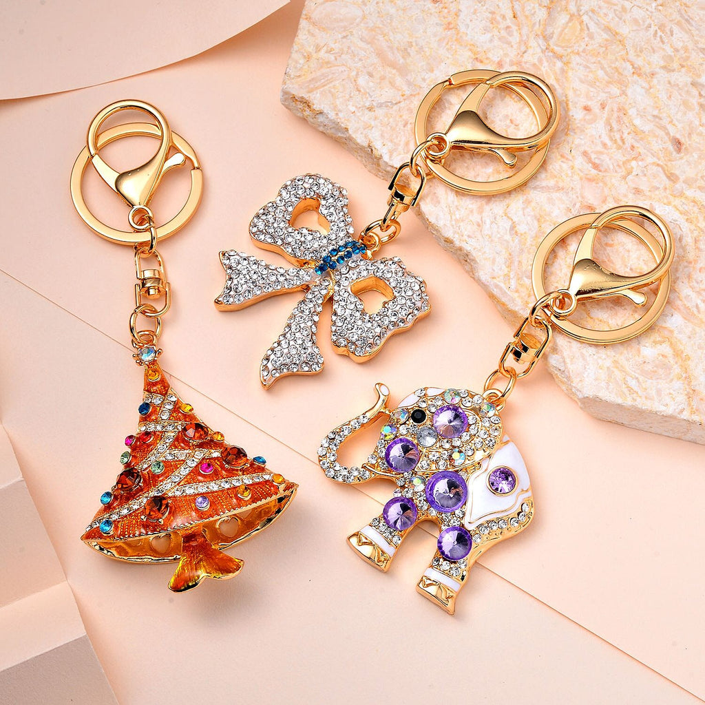 Set of 3 Sparkling Crystal Keychains With Different Designs (Bowknot, Christmas Tree, and Elephant) - Multi