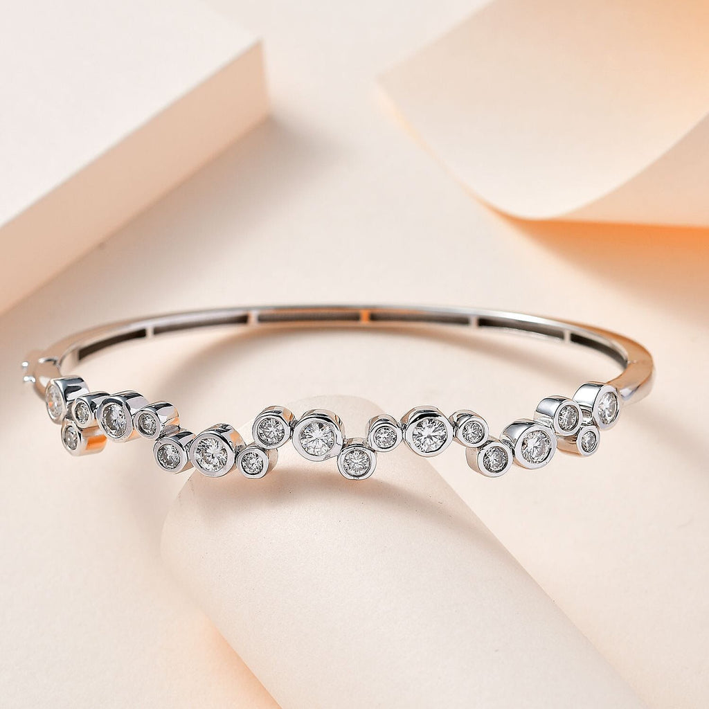 Moissanite Bangle (Size 7.5) in Platinum Overlay Sterling Silver 2.49 Ct, Silver Wt 14.14 Gms.