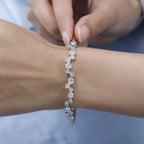 Moissanite Bangle (Size 7.5) in Platinum Overlay Sterling Silver 2.49 Ct, Silver Wt 14.14 Gms.