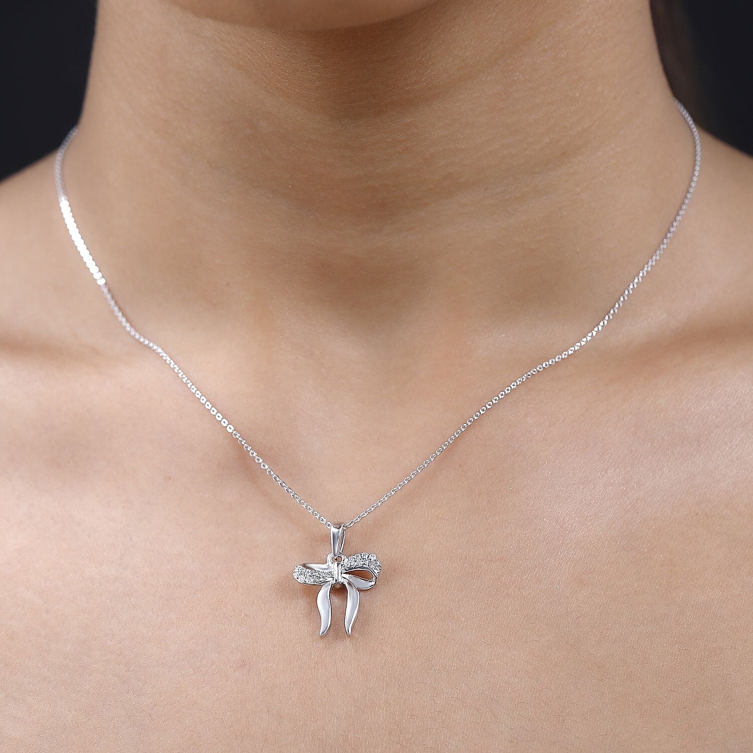 Moissanite Bow Tie Ribbon Pendant in Platinum Overlay Sterling Silver 4234485 1