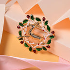 White Austrian Crystal Enamelled Reindeer Brooch in Yellow Gold Tone