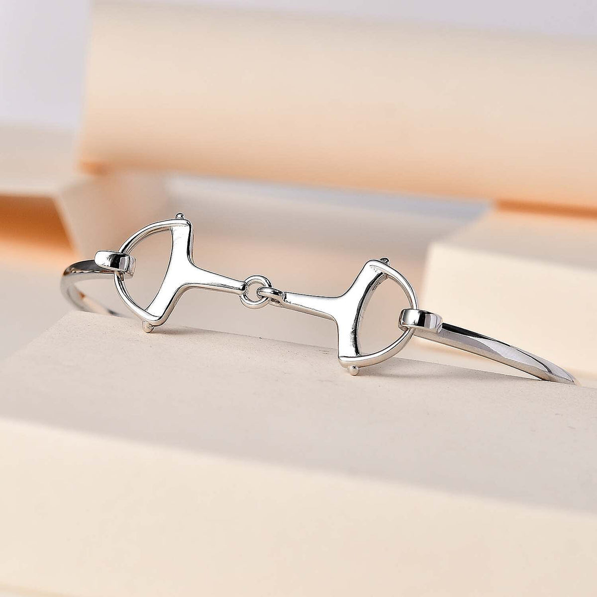 Designer Inspired Platinum Overlay Sterling Silver Snaffle Bangle (Size 7.5) 7652337 1