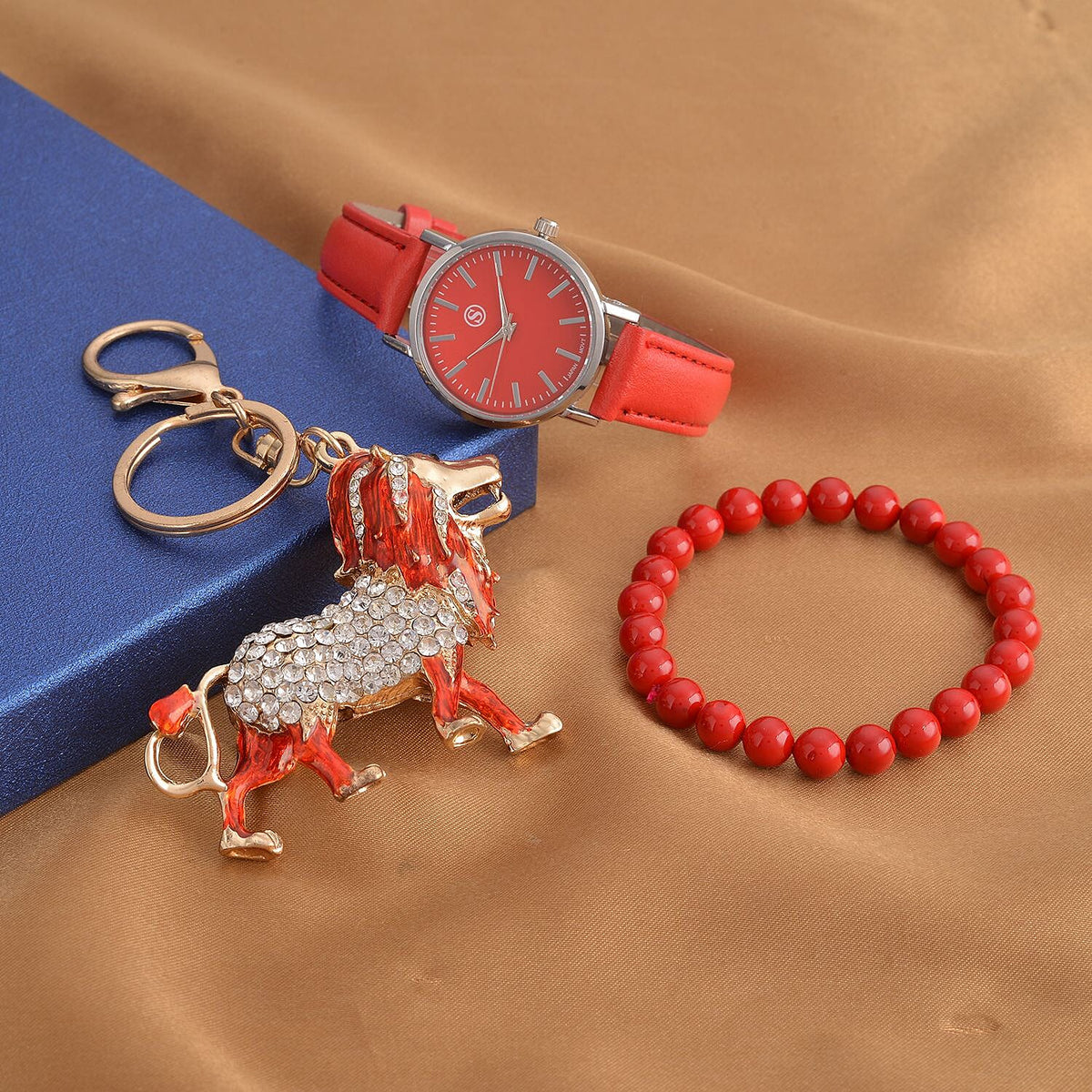 3 Piece Set - Red Howlite Stretchable Beads Bracelet (Size 8), White and Black Austrian Crystal Studded Lion Key Chain and STRADA Water Resistant Watch with Red Strap 4118735 1