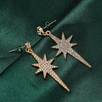 White Austrian Crystal Star Drop Earrings in Yellow Gold Tone