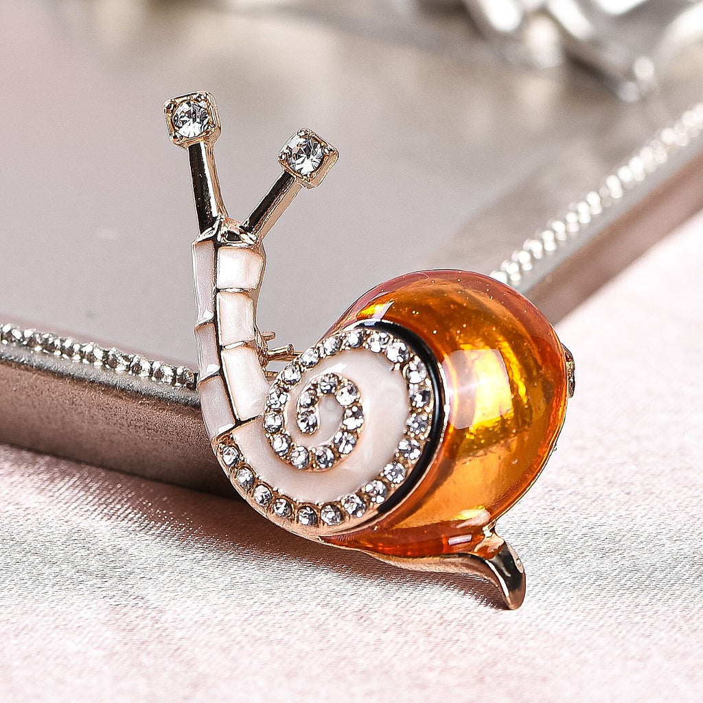 White Austrian Crystal Enamelled Snail Brooch in Gold Tone