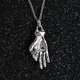 Tanzanite Hand Holding Pendant With Chain in Platinum Overlay Sterling Silver