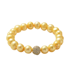 Golden Shell Pearl and Simulated Diamond Stretchable Bracelet (Size 7) in Silver Tone